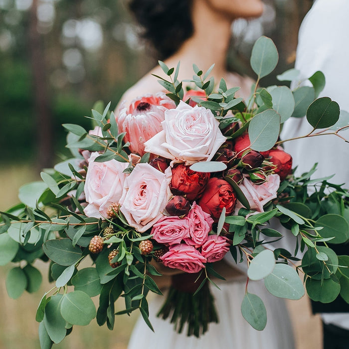 DIY faux bridal bouquet featuring pink and red roses from Silks Are Forever