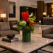 24.5"Hx17"W Artificial Protea, Bromeliad & Grass Flower Arrangement w/Glass Vase -Red/Green - WF9319-RE/GR